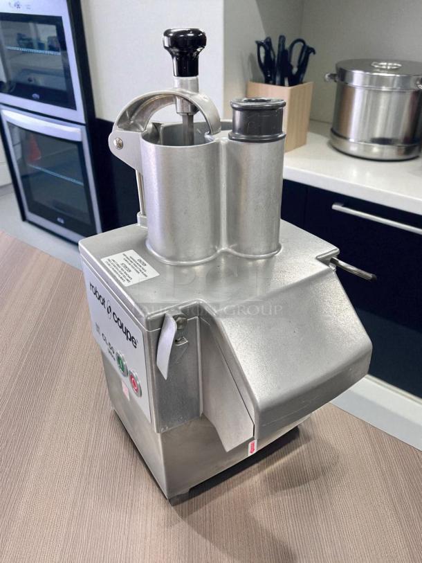 Robot Coupe CL50 Ultra food processor, heavy-duty, commercial-grade, clean condition, labeled controls, tested, silver finish.