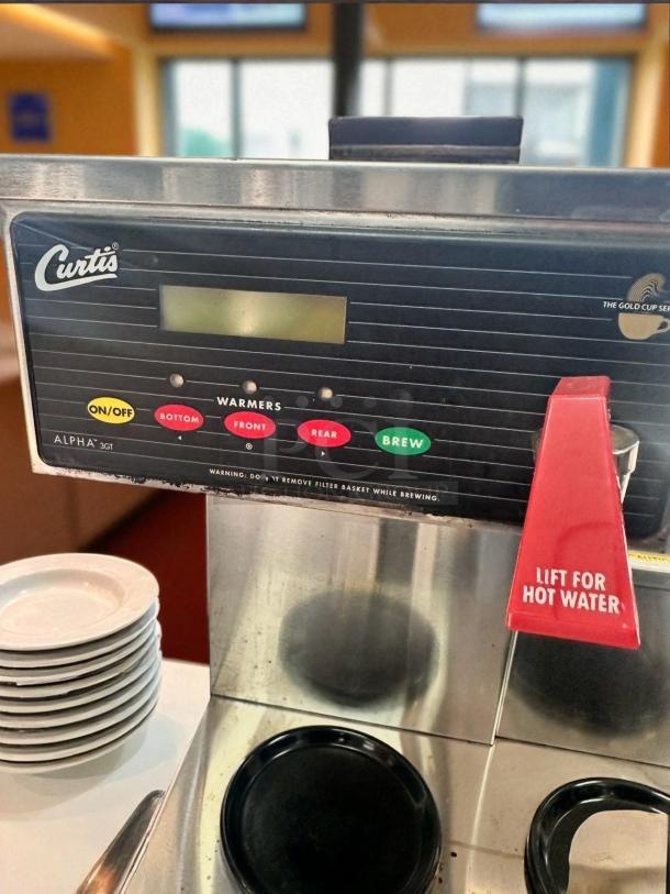 Curtis ALP3GTR12A000 3-burner coffee brewer, automatic, tested, working, stainless steel, 120V, control panel with labeled buttons.