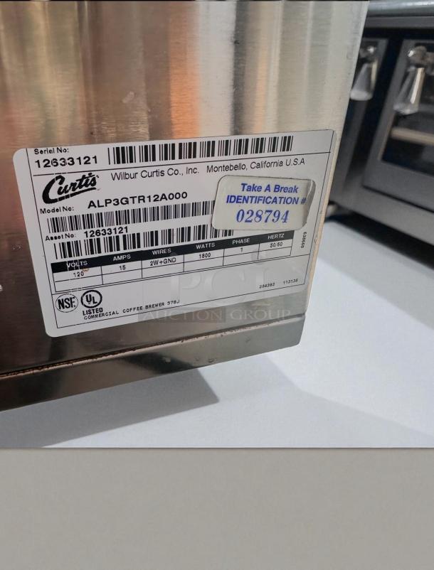 Curtis ALP3GTR12A000 3-burner coffee brewer, stainless steel, 120V, fully tested, excellent condition, model label visible.
