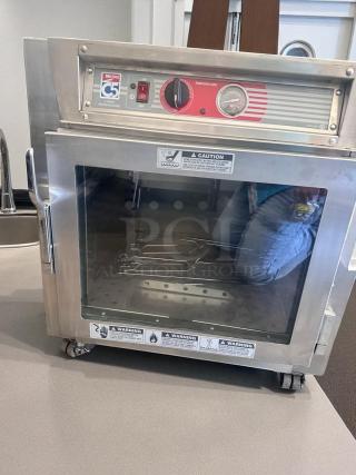 Metro C5 4 Series Heated Holding Cabinet, Model C563L-SFC-UA, excellent condition, temperature control, 120V, safety warnings visible.