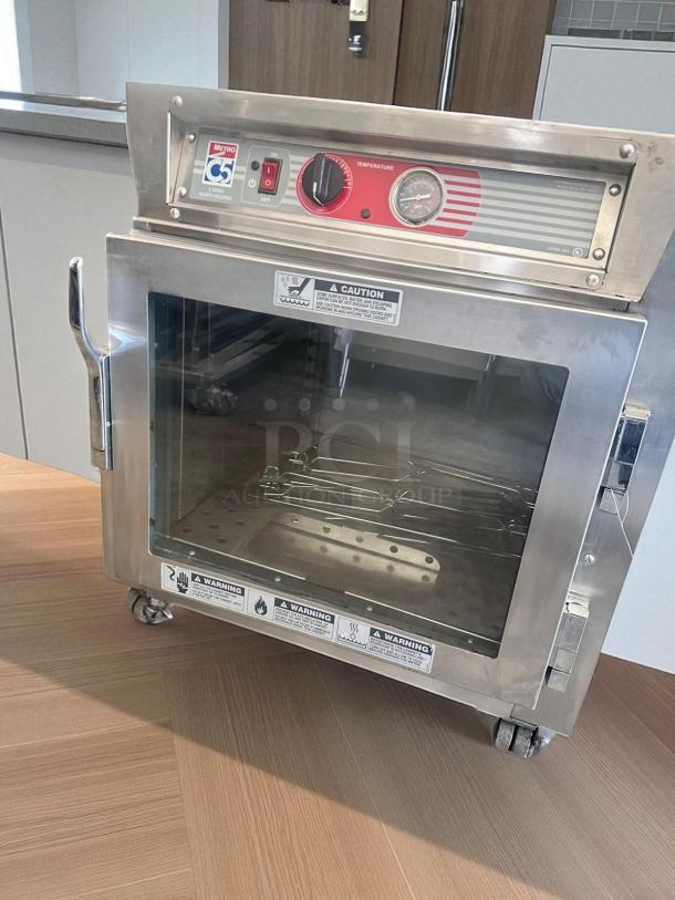 Metro C5 4 Series Heated Holding Cabinet, Model C563L-SFC-UA, in excellent condition, stainless steel, visible control panel and warning labels.