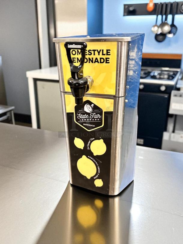 Newco FPM-1 lemonade dispenser, excellent condition, NSF listed, countertop model, fully tested, branded "Homestyle Lemonade."