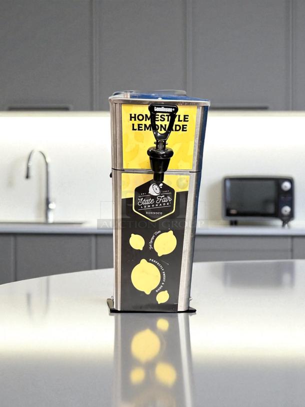 Newco FPM-1 lemonade dispenser in excellent condition, stainless steel, NSF listed, fully tested, countertop design, labeled "Homestyle Lemonade."