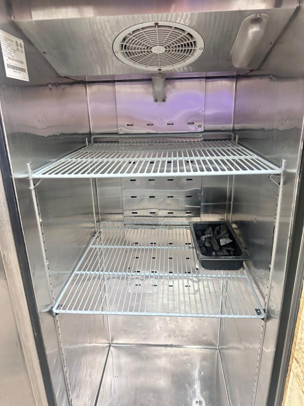 Turbo Air MBF8001GR Single-Door Reach-In Freezer in excellent condition, featuring interior shelves and cooling fan.