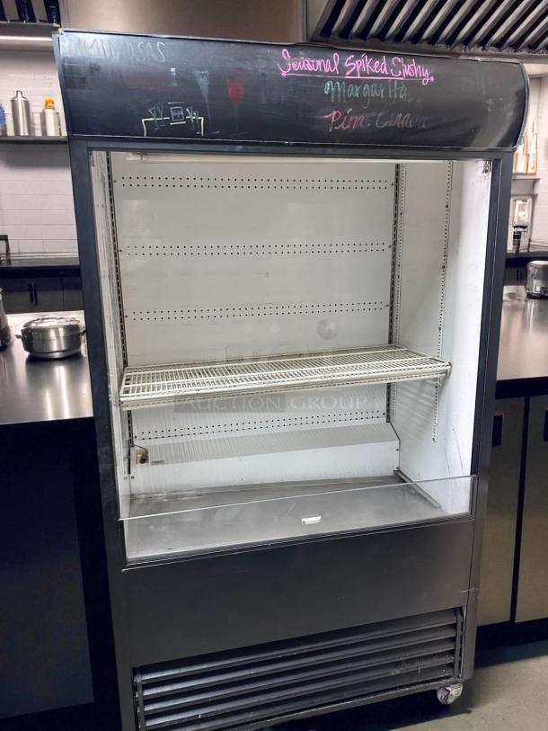 True TAC-48 refrigerated air curtain merchandiser, 48", excellent condition, 208/230V, fully tested and working, with shelf.