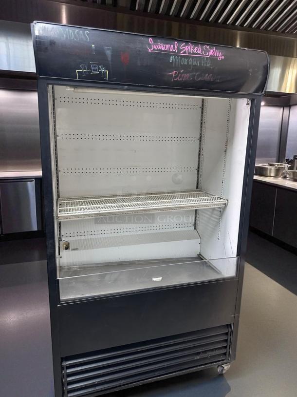 True TAC-48, 48" refrigerated air curtain merchandiser in excellent condition, fully tested and working, black exterior.