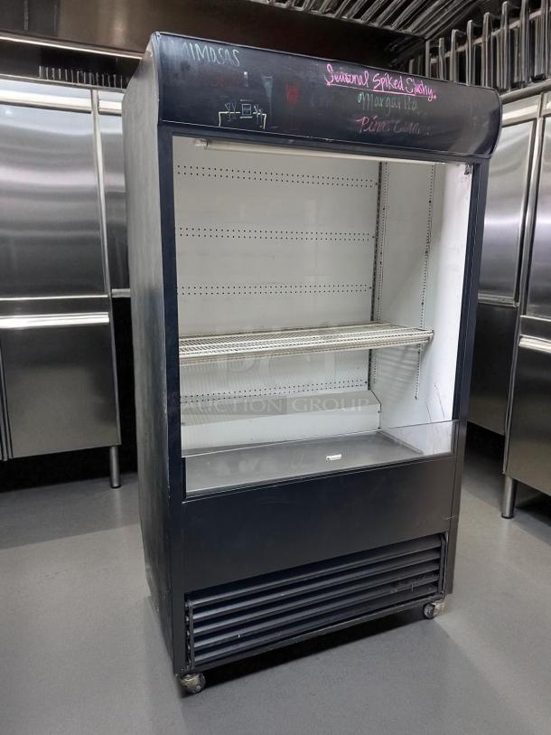 True TAC-48, 48" refrigerated air curtain merchandiser, excellent condition, 208/230V, chalk writings on the top panel, fully tested.