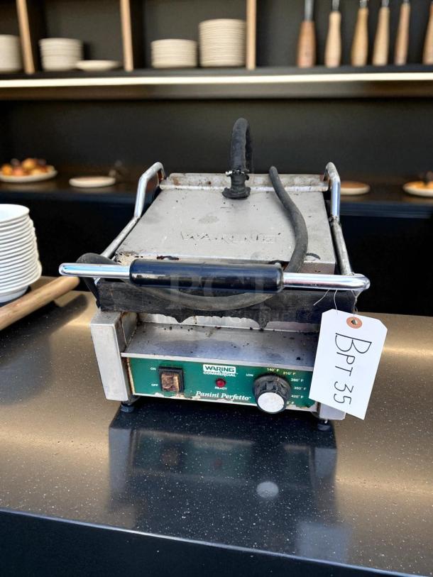 Waring Commercial Panini Perfetto panini press in working condition, with temperature dial, labeled tag "Bpt 35."