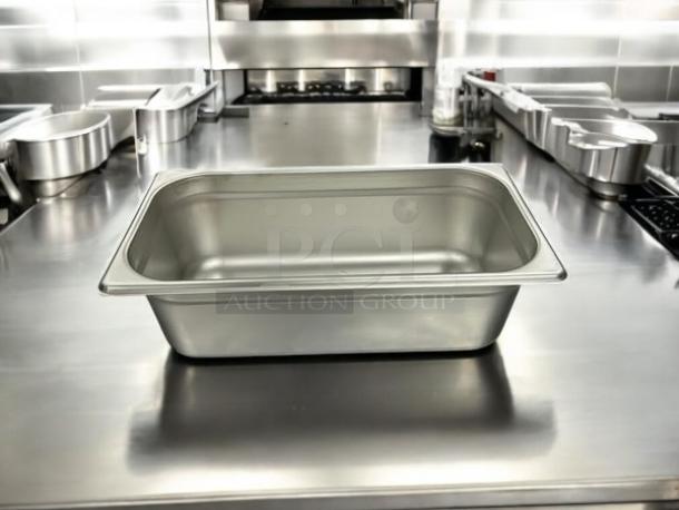 Brand new Browne Foodservice anti-jam steam pan, 1/3 size, 4" deep. Model 22134, stainless steel, pristine condition.