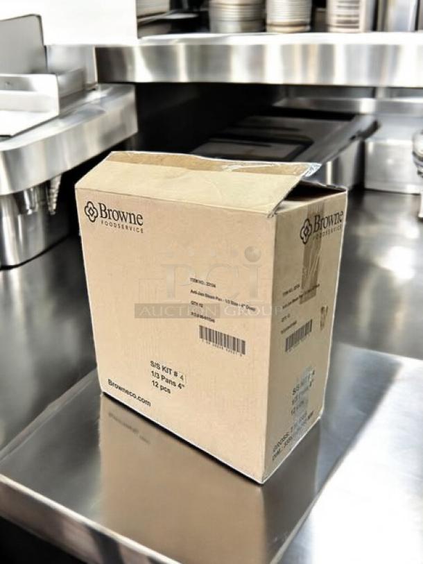 Brand New Browne Foodservice Anti-Jam Steam Pan, model 22134, 1/3 size, 4" deep, shown in unopened box on stainless steel surface.