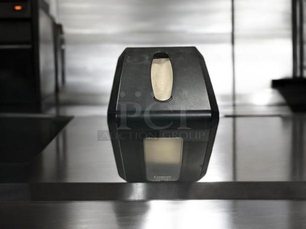 Black Dixie Ultra napkin dispenser by GP PRO, model 54527A, holds 275 napkins. Excellent condition, fully tested.