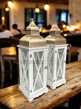 Dockery Farmhouse Lantern in excellent condition; ornate metal tops, glass panes, white wood frame; rustic decor piece.