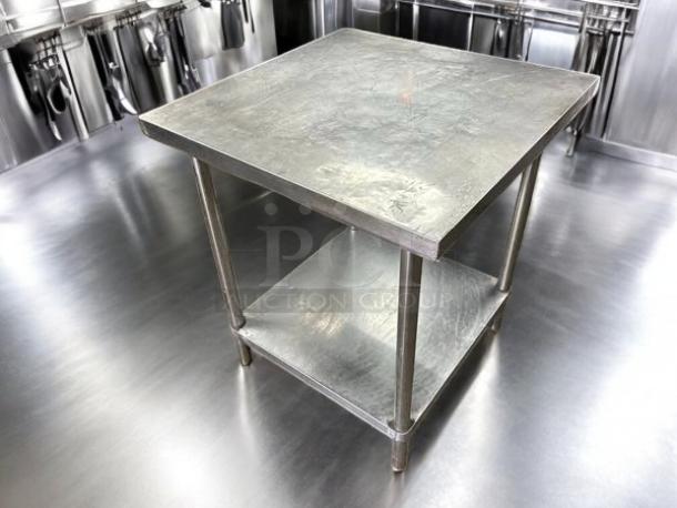 Stainless steel worktop table, 30" W x 30" D x 34" H, excellent condition, fully tested, with lower shelf, ideal for kitchen use.