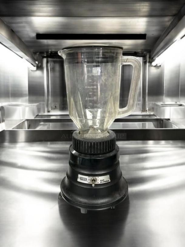Waring Commercial BB150 blender, 48 oz, two-speed, in great condition, fully tested, clear jar with handle on black base.