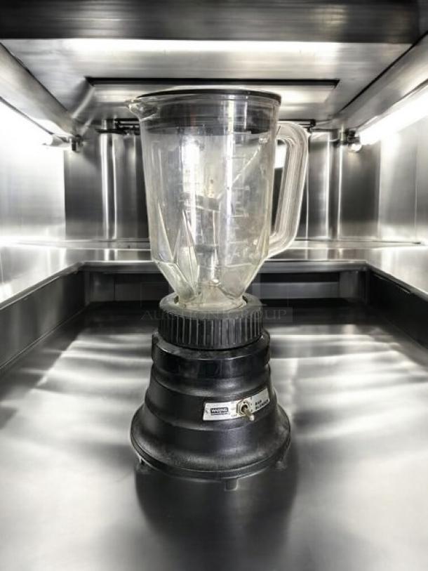 Waring BB150 48 oz bar blender; two-speed, tested working; excellent condition, clear jar, black base, visible label.