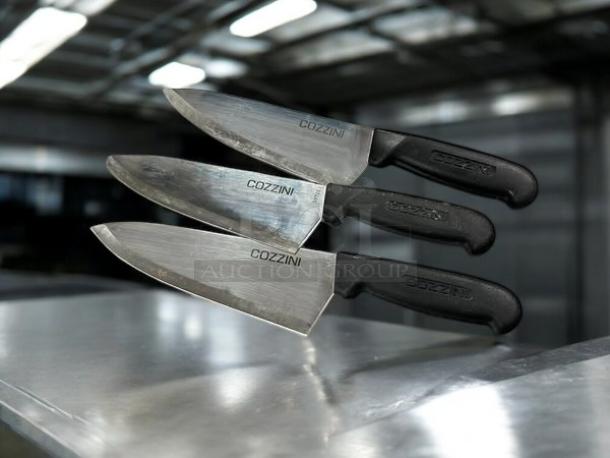 Cozzini 8" chef knives in excellent condition; razor sharp, black handles, stainless steel blades with brand markings.