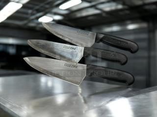 Cozzini 8" chef knives in excellent condition; razor sharp, black handles, stainless steel blades with brand markings.