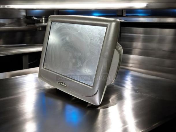 Radiant Systems P1520-0275-BA POS screen, black, great condition, tested and working, on reflective surface.