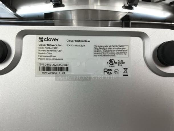Clover Station Solo C501 POS system showing model and compliance labels, serial number S/N: C501J0232252289.