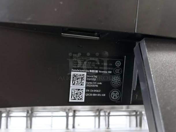 Dell E2016H 20" LED monitor, black, in excellent condition. Shows service tag and serial number for verification.