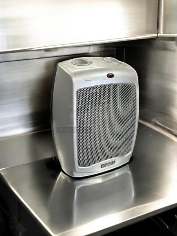 Lasko electric portable heater, great condition, heats 100 sq ft, silver finish, fully tested and working.