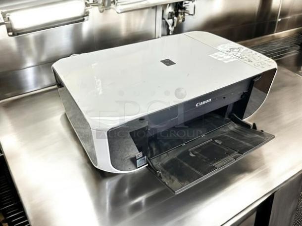 Canon Pixma MP210 inkjet printer in excellent condition, fully tested and working, with open paper tray and visible control panel.