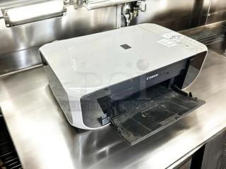 Canon Pixma MP210 inkjet printer in excellent condition, fully tested and working, with open paper tray and visible control panel.