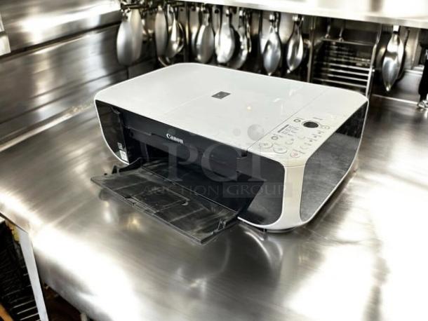 Canon Pixma MP210 All-In-One Inkjet Printer in excellent condition, fully tested and working, shown on metal surface.