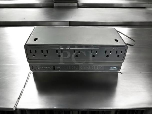 Schneider Electric BE600M1 APC Backup Generator, six outlets, fully tested, excellent condition, visible APC logo.