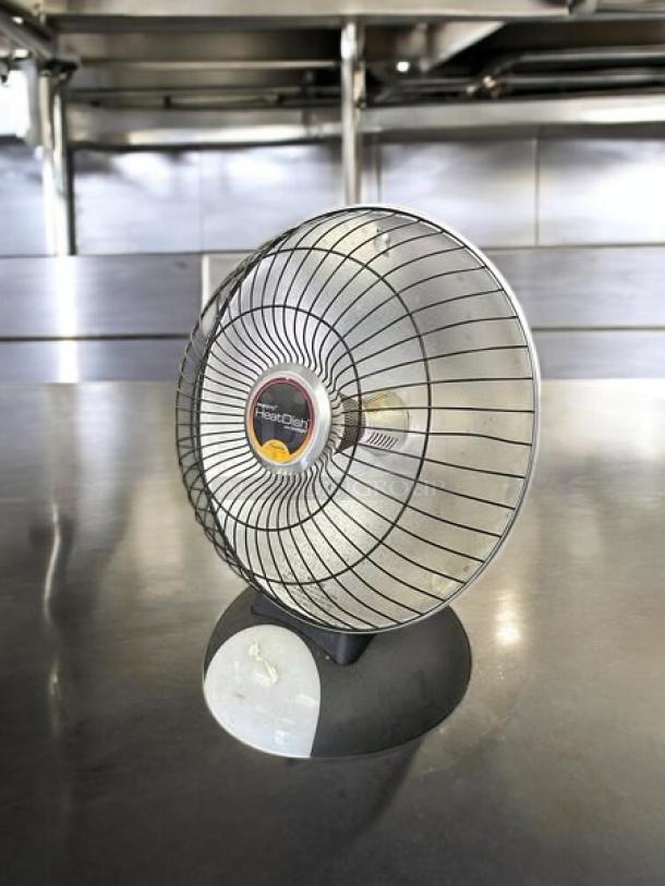 Presto HeatDish parabolic electric heater, 115v. Excellent condition, fully tested. Features protective grill and control dial.