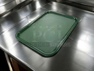 Brand new Carlisle CT141808 forest green polypropylene tray on a metal surface. Rectangular, durable, fully tested.