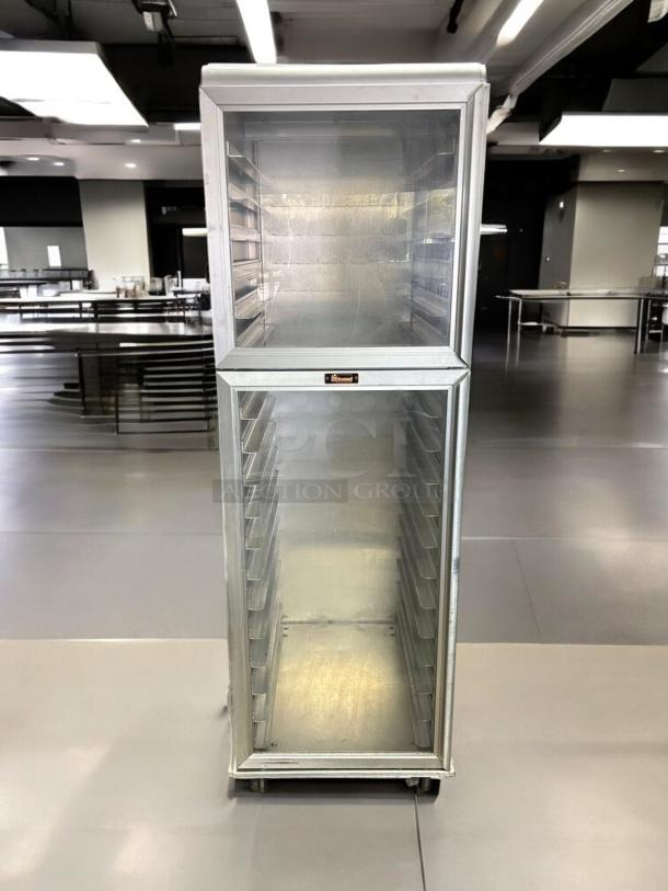 Lockwood CA72-RR18-CD-R clear door display cabinet, 18 pan capacity, excellent condition, rolls smoothly, model label visible.