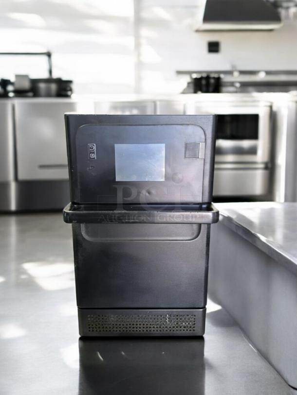Merrychef eikon e1s high-speed countertop oven, excellent condition, 208/240V, black, tested and operational.