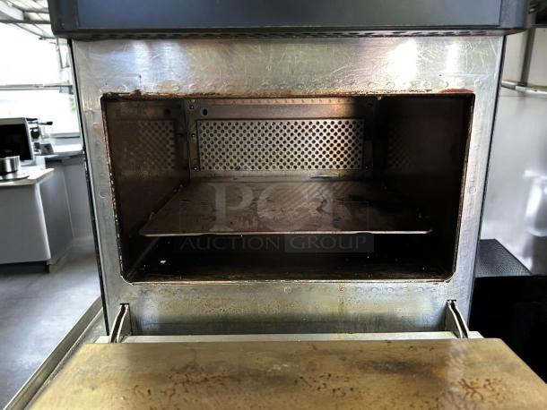 Merrychef eikon e1s high-speed oven in great condition, 208/240V. Interior view showing operational chamber.