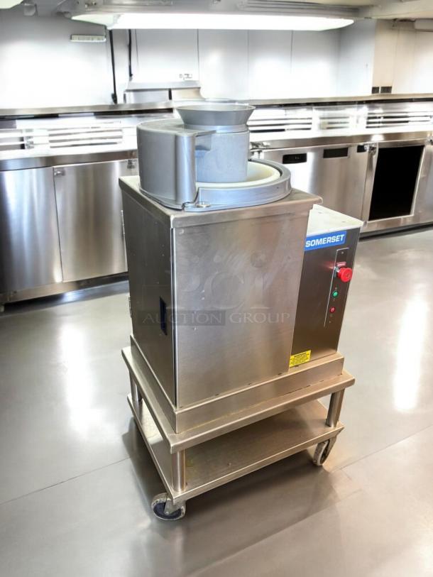 Somerset SDR-400T dough rounder in excellent condition, 120V, 3/4 HP, tested and working, stainless steel build, on a wheeled stand.