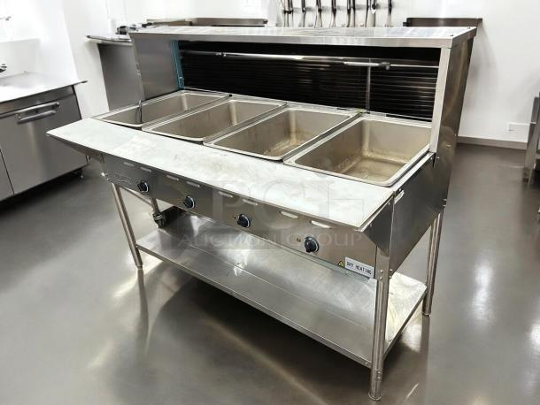Avantco STE-4SA four-pan steam table with undershelf and sneezeguard, 120V, tested and working in good condition.
