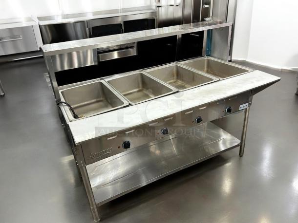 Avantco STE-4SA electric steam table with four pans, undershelf, and sneezeguard. Good condition, 120V, tested working.