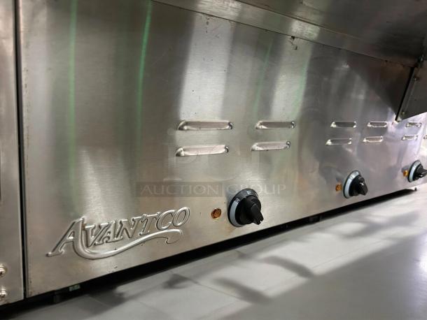 Avantco STE-4SA electric steam table in good condition, features four pans, undershelf, sneeze guard, labeled controls, 120V.