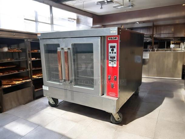 Vulcan VC4GD gas convection oven, great condition, 50,000 BTU, tested, working, stainless steel, on wheels for mobility.