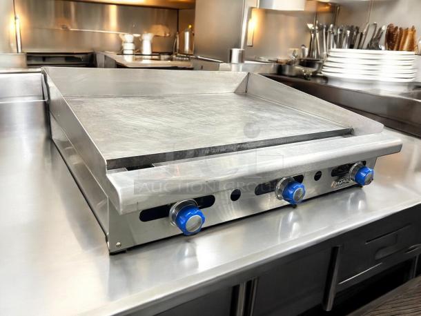 Imperial IMGA-3628 36" commercial gas griddle with three blue control knobs, stainless steel, tested, working condition.