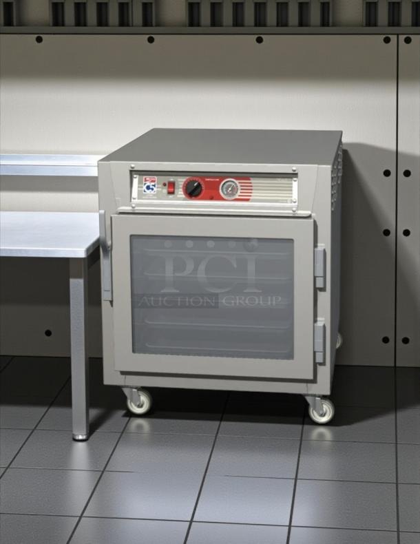 Metro C563L-SFC-L C5 heated holding cabinet, clear doors, under counter, 120V, tested, working condition, on wheels.