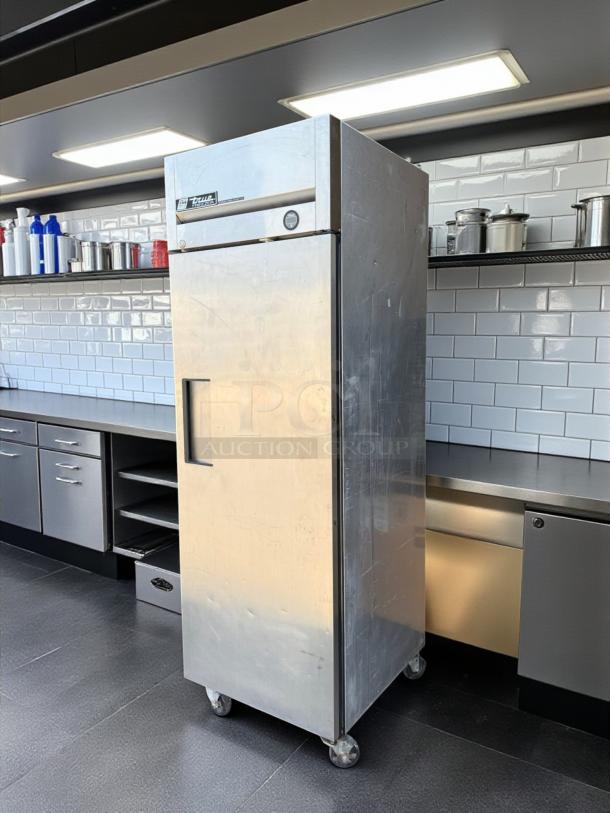 True TM-24 top mount cooler, 24 Cu.Ft, stainless steel, swing door, great condition, tested, working, on casters.