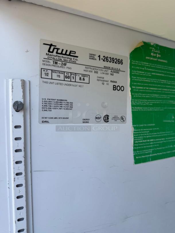 True TM-24 Commercial Cooler label showing model, serial number, voltage, refrigerant info, and certifications.