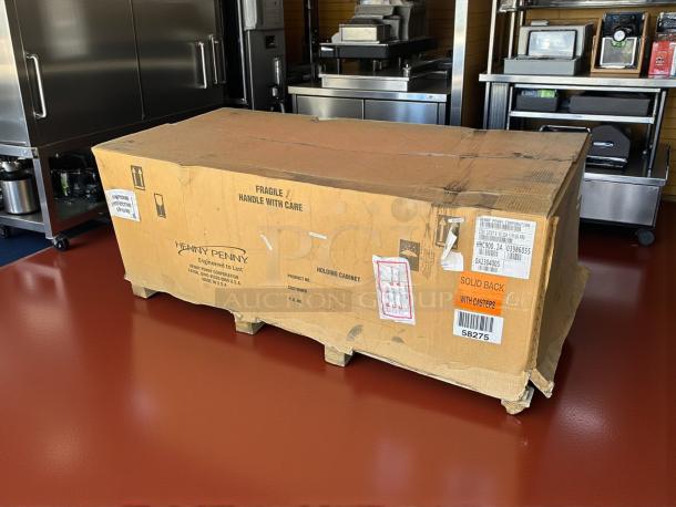 New Henny Penny HHC-900 holding cabinet in original box, labeled with model and handling instructions.