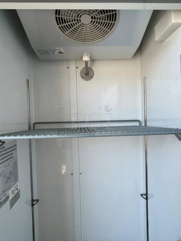 Avantco A-19F-HC 29" reach-in freezer, solid door, 115v, excellent condition, tested working, interior view with shelving.