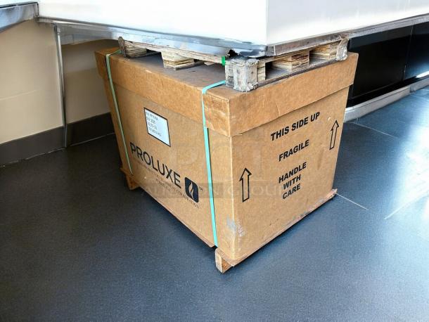 New Proluxe Flex X1 PP1818A Clamshell Pizza Dough Press in box, labeled "FRAGILE" and "HANDLE WITH CARE."