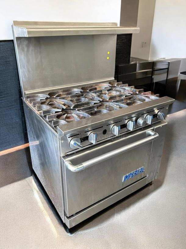 Imperial IR-6NG 36" natural gas range with 6 burners and standard oven. Stainless steel, tested and working condition.