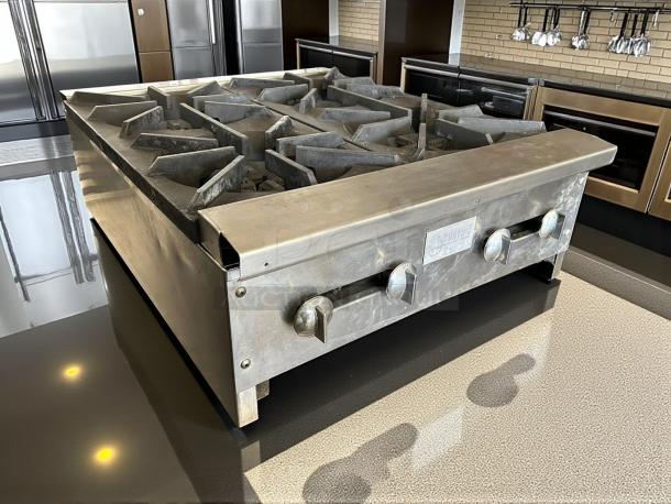 Stratus SHP-24-4 countertop 4-burner gas range, stainless steel, tested and working, visible brand label, excellent condition.