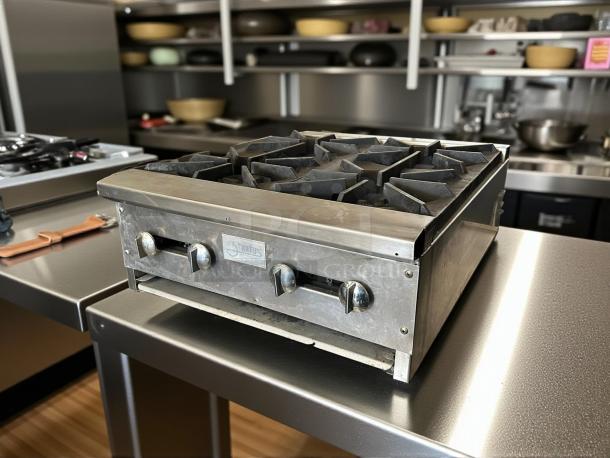 Stratus SHP-24-4 countertop 4-burner gas range, stainless steel, tested and working, featuring control knobs and brand label.