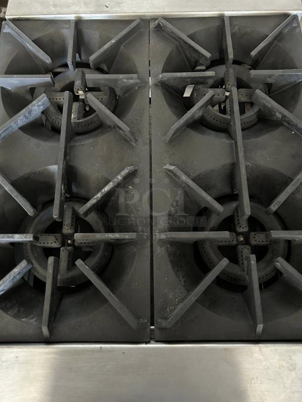 Stratus SHP-24-4 countertop gas range, 4 burners, tested and working, American brand, used condition, durable cast iron grates.